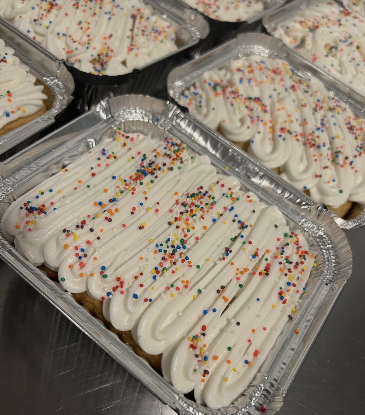 Puerto Rican dessert trays with cream topping and sprinkles